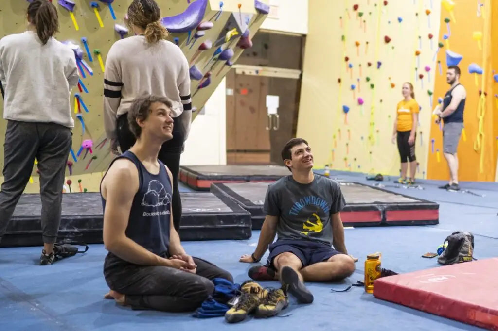 girl climbing indoor rock wall
